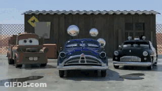 Red Volvo Driving Down Road At Night GIF