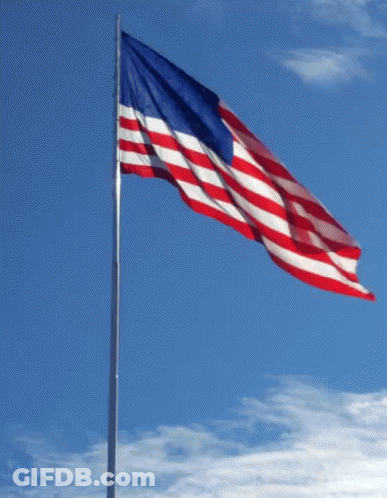 Red White And Blue American Flag Flying In Wind GIF