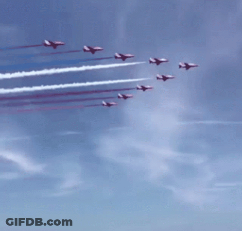 Red White And Blue Jets Flying Over A Crowd GIF