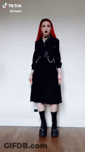 Redhead Girl In Black Dress And Platform Boots GIF