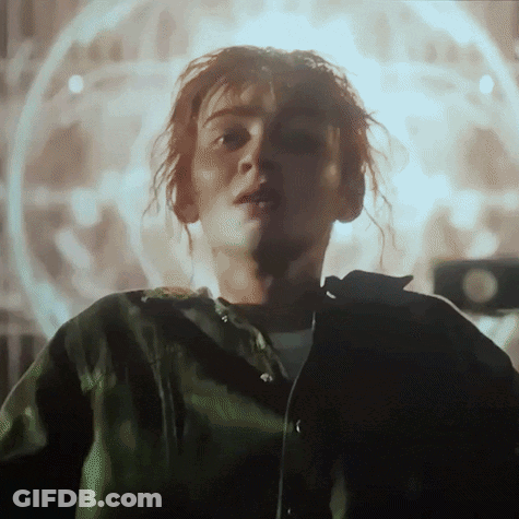 Redhead In Black Shirt And Tan Jacket GIF