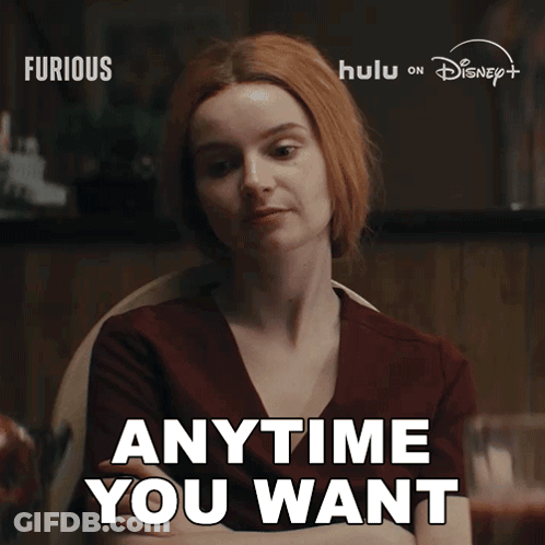 Redhead Saying Anytime You Want Sitting GIF