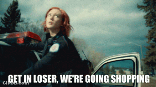 Redhead Standing Next To Police Car Saying Get In Loser We're Going Shopping GIF