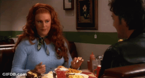 Redhead Woman And Man At Diner GIF