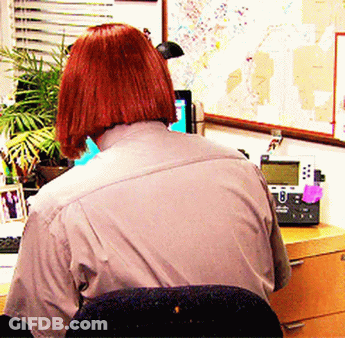 Redhead Woman At Desk With Telephone And Map GIF