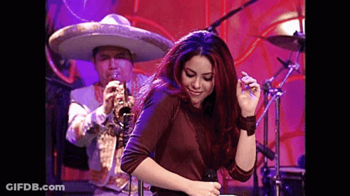 Redhead Woman Dancing With Sombrero Trumpet Player GIF