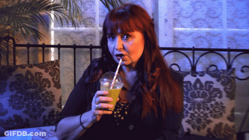 Redhead Woman Drinking Through Straw GIF