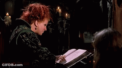 Redhead Woman Holding Book Making Funny Face GIF