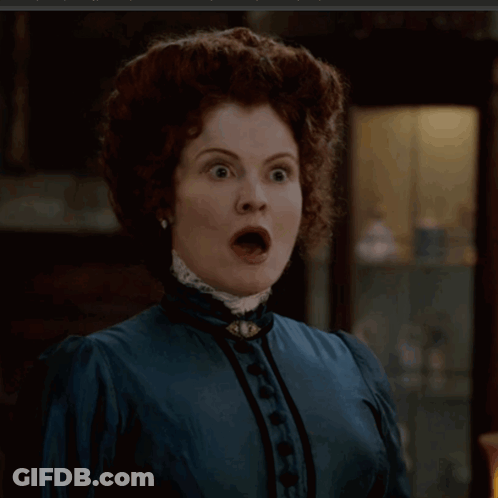 Redhead Woman In Blue Dress With Black Buttons GIF