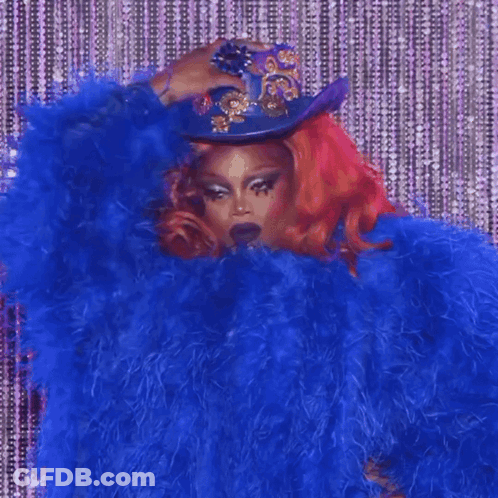 Redhead Woman In Blue Fur Coat And Cowboy Hat GIF