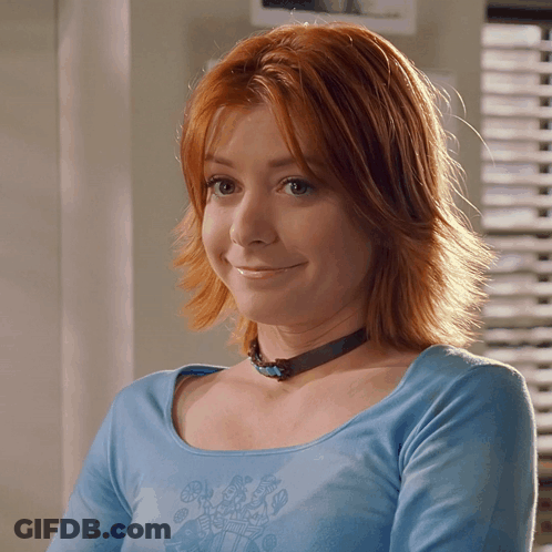 Redhead Woman In Blue Shirt And Choker GIF