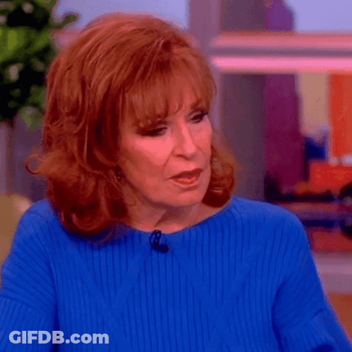 Redhead Woman In Blue Sweater And Earrings GIF