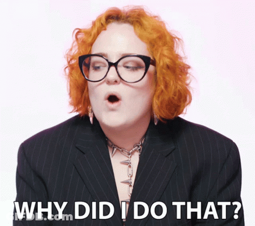 Redhead Woman In Glasses And Black Suit Saying Why Did I Do That GIF