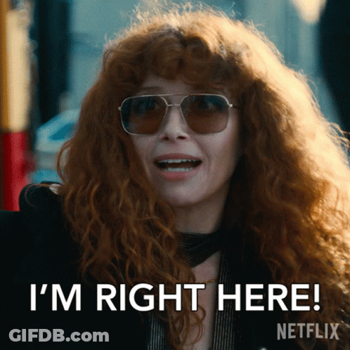 Redhead Woman In Sunglasses Saying I'm Right Here GIF