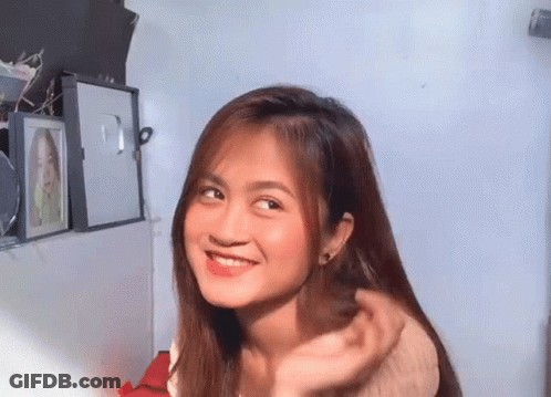 Redhead Woman Looking At Phone GIF