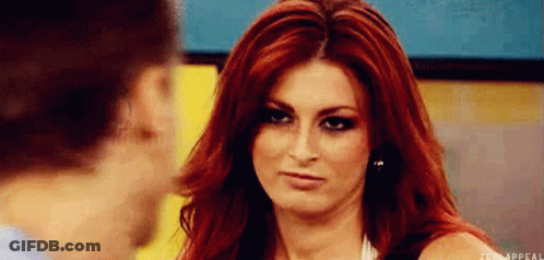 Redhead Woman Making Face At Man GIF