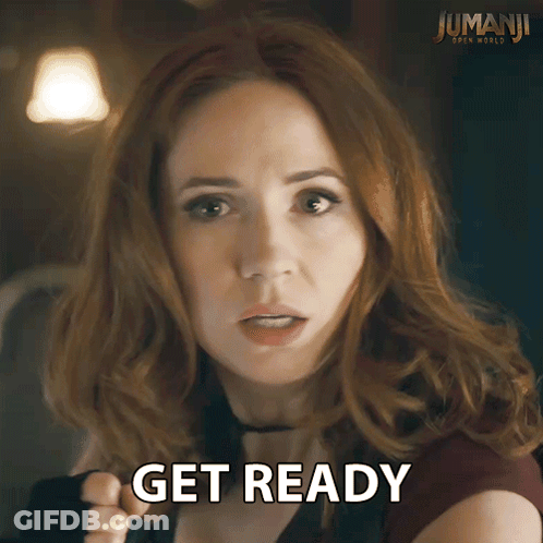 Redhead Woman Says Get Ready In Front Of Jumanji Poster GIF