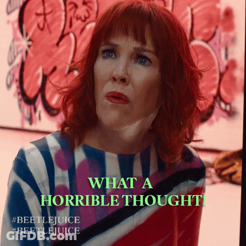 Redhead Woman Says What A Horrible Thought In Front Of Graffiti GIF