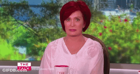 Redhead Woman Sitting With Coffee At Window GIF