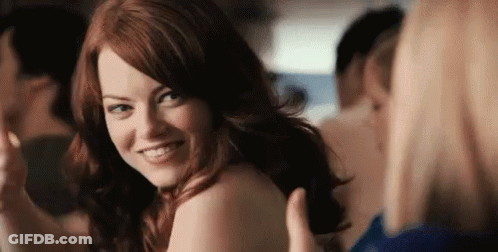 Redhead Woman Smiling Over Her Shoulder GIF