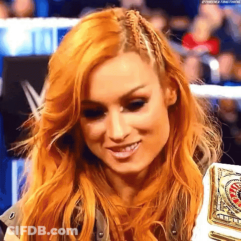 Redhead Woman Smiling With Championship Belt In Wrestling Ring GIF