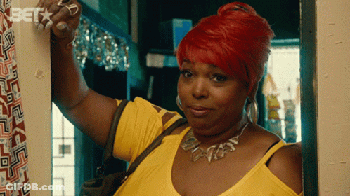 Redhead Woman Standing In Doorway With Bet On Wall GIF