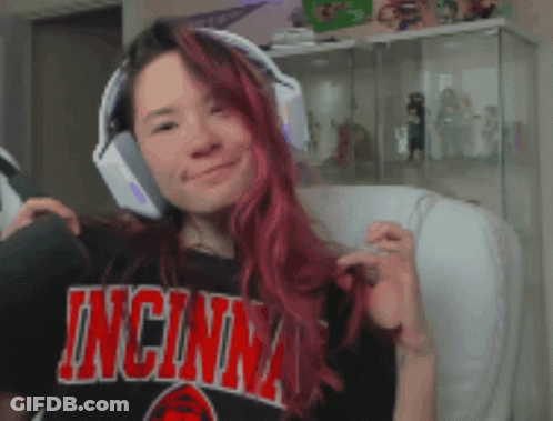 Redhead Woman Wearing Headphones And Cincinnati Shirt GIF