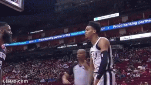 Referee Between Basketball Players GIF