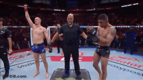 Referee Between Two Boxers In Ring GIF