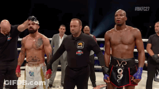 Referee Between Two Boxers In Ring GIF