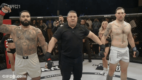 Referee Between Two Fighters In Ring With APFC21 GIF