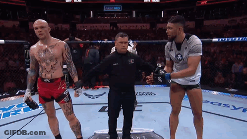 Referee Between Two Men In Boxing Ring GIF