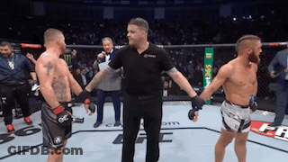 Referee Between Two Men In Boxing Ring GIF