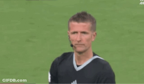 Referee Blowing Yellow Whistle At Soccer Player GIF