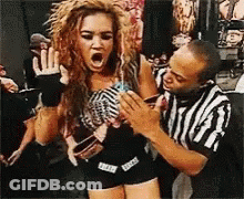 Referee Holding Screaming Woman In Wrestling Match GIF