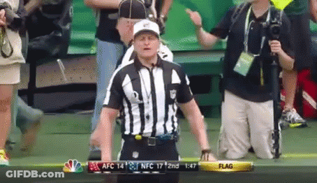 Referee In Front Of Scoreboard Saying Flag GIF