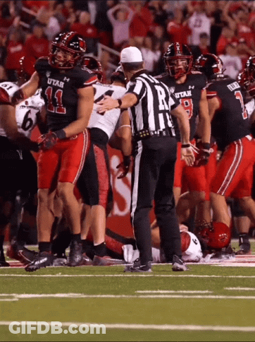 Referee In Front Of Utah Football Players GIF
