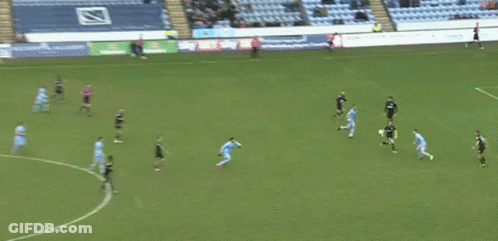 Referee In Purple Shirt With EA On Sleeve GIF