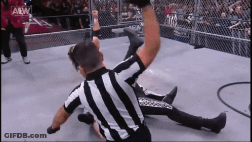 Referee Lying On Ground During Wrestling Match GIF