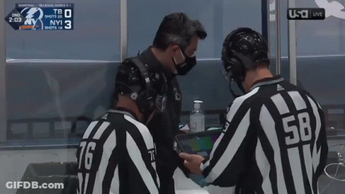 Referee Number 58 Talking To Another Referee GIF