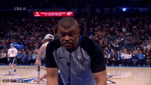 Referee On Basketball Court In Front Of Crowd GIF