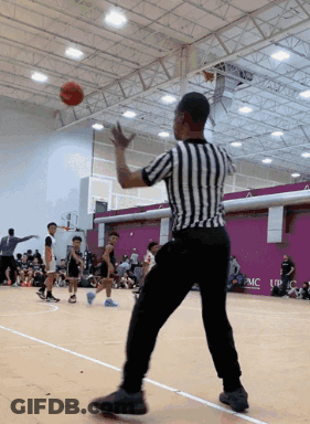 Referee On Basketball Court With UPMC Sign GIF