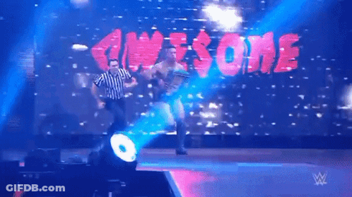 Referee On Stage In Front Of Awesome Screen GIF