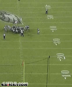 Referee Standing In Front Of Eagles Sign GIF