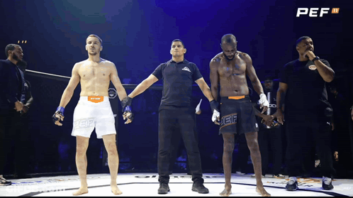 Referee Stands Between Two Fighters With PEF GIF