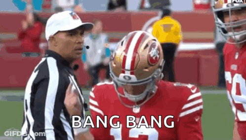 Referee Talking To Football Player On Field GIF