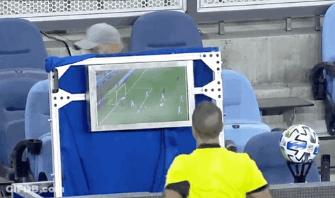 Referee Watching Soccer Game On Monitor GIF