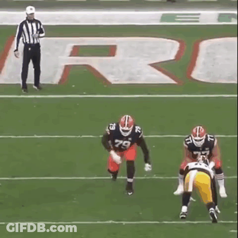 Referee Watching Two Football Players GIF