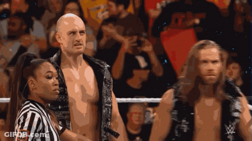 Referee With W Logo Between Two Wrestlers GIF