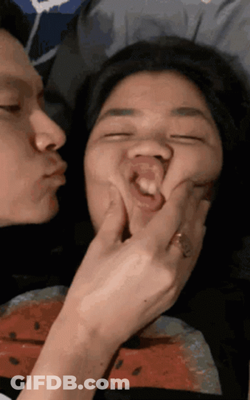 Regular Couple Kisses In Bed GIF